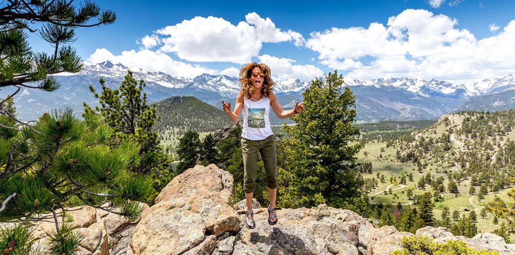 Cindy jumping on a rock