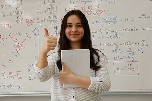Girl giving a thumbs up sign